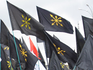 black flags with gold, eight-pointed star